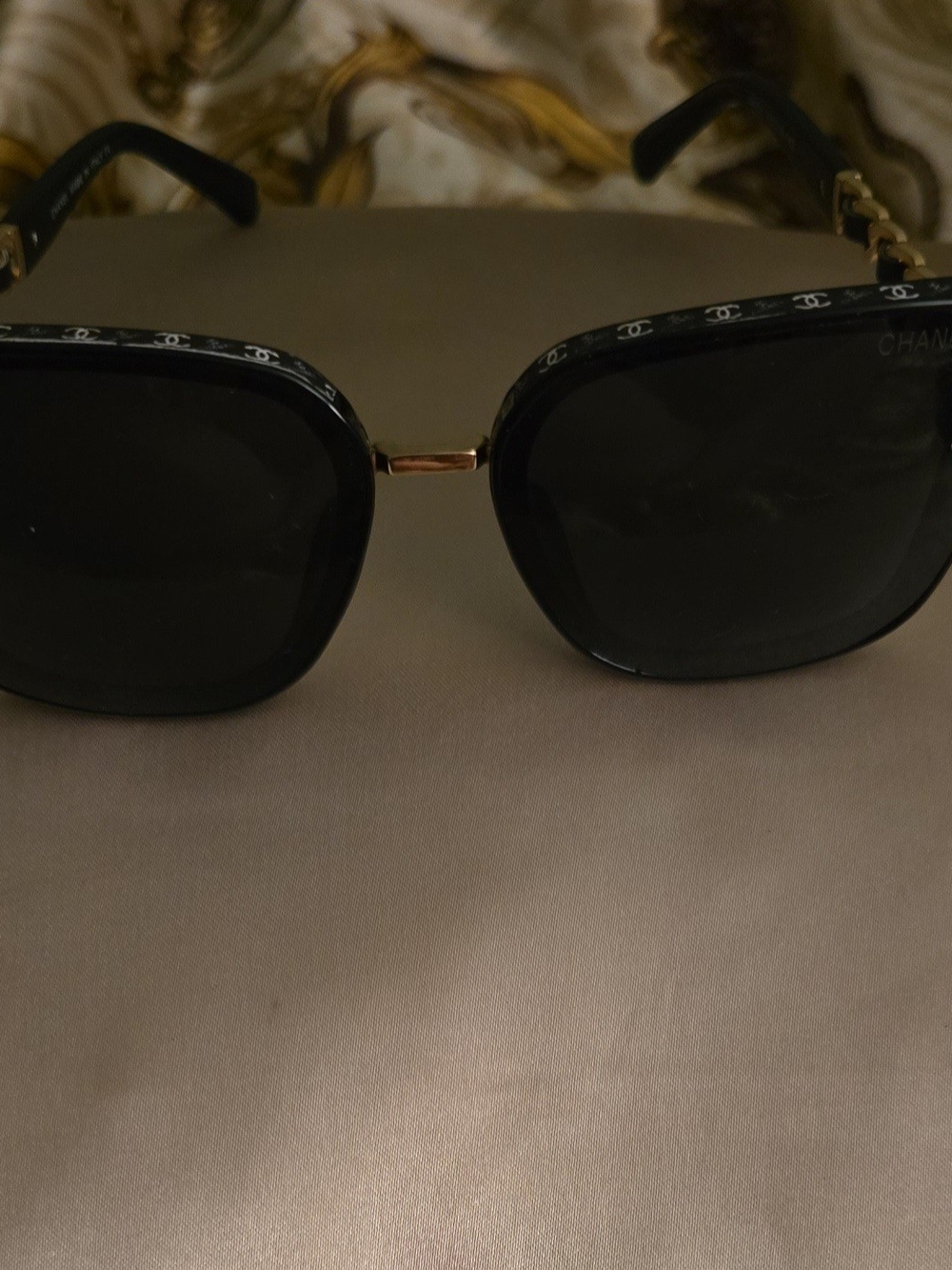 CHANEL Black Sunglasses with Gold Bridge and Logo Trim